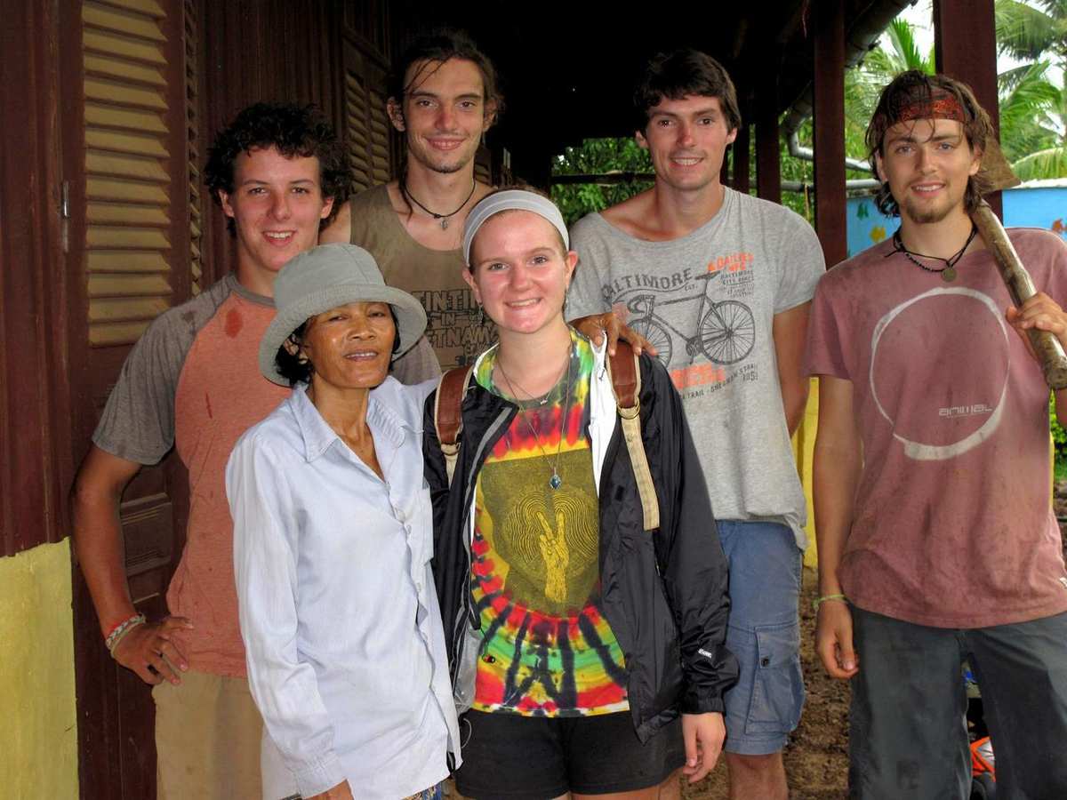 Volunteers with local community member