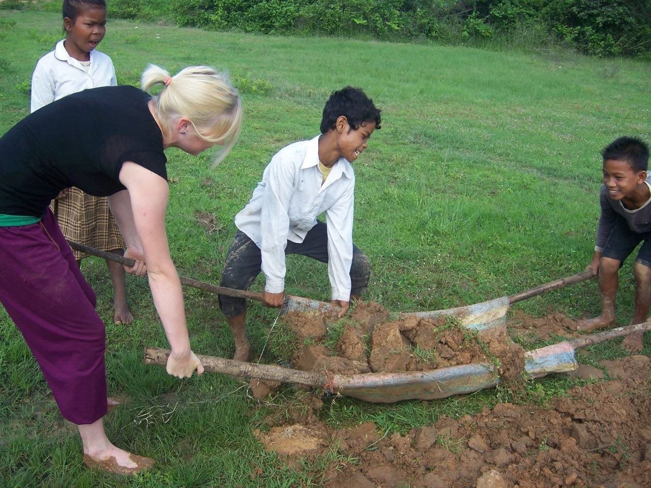 Volunteers working with community in rural Cambodia
